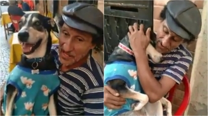 Cadela de morador de rua faz sucesso nas redes ao fingir dormir quando o dono canta música de ninar. (Foto: Reprodução Facebook/Edna Frigato)
