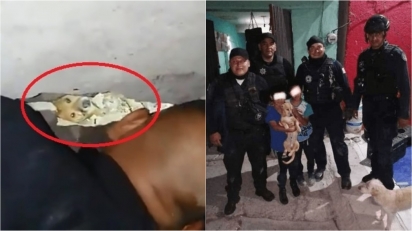 Policiais salvam cachorro que ficou preso entre paredes após sofrer queda e as crianças agradecem. (Foto: Twitter/@ActualidadER)