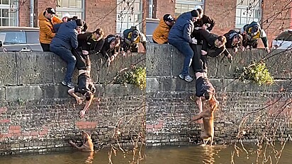 Heróis! Jovens se juntam para resgatar cachorro que caiu em canal.
