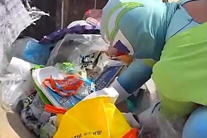 Homem fantasiado de super-herói encontra rostinho peludo dentro de caçamba de lixo.