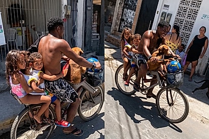 “Aí vai a bicicleta da felicidade” — Pai carrega filhos e cão na bicicleta em cena simples que define o amor.